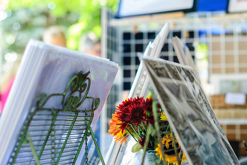 Flowers and photographs on display at arts and crafts show