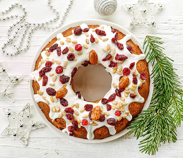 istock Christmas cake on white wooden table 635933426