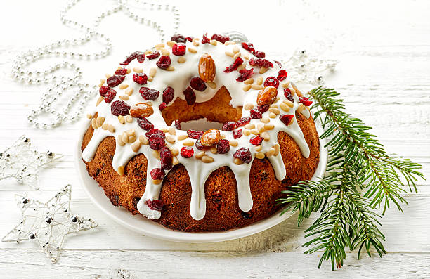 istock Christmas cake on white wooden table 635933474