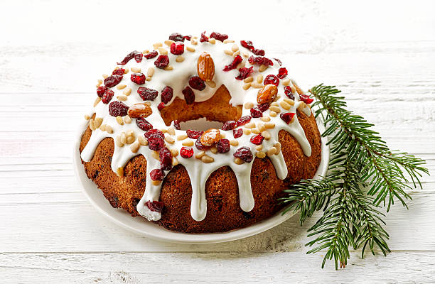 istock Christmas cake on white wooden table 635933514