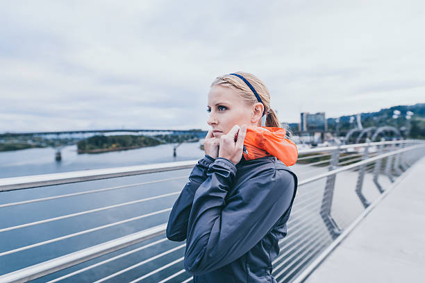 istock Attractive adult female stretching before a chilly run during fall 635933872