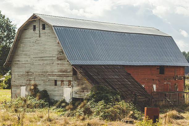 istock Creepy old barn in rural landscape 635934282