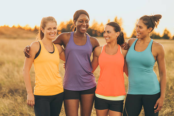 istock Attractive group of female runners posing for camera 635935172