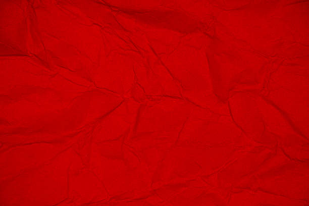 istock Crumpled paper texture.Red paper sheet. 635938048