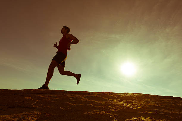 istock Hispanic Male Running Up A Granite Boulder In The Mountains 635938134