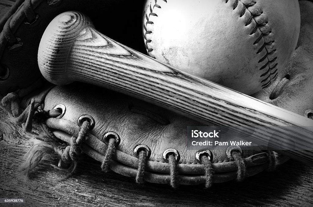 Old Baseball and Bat A black and white image of an old baseball glove and bat. Baseball - Ball Stock Photo