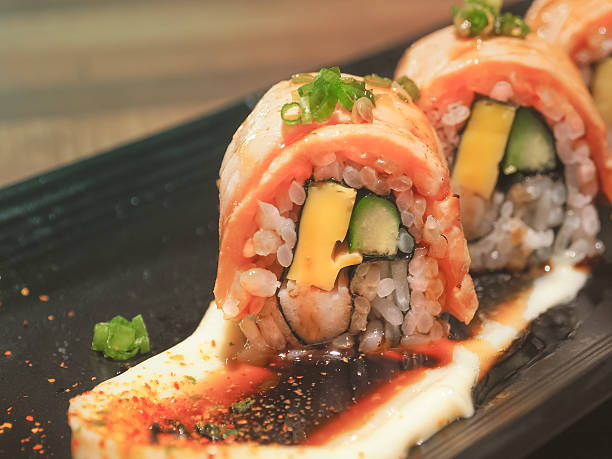 istock Salmon sushi roll maki ,Japanese cuisine 635941430