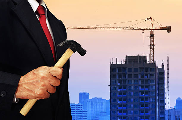 istock business man hold hammer 635941468