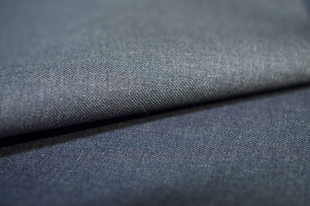 istock close up roll blue gray fabric of suit 635943272