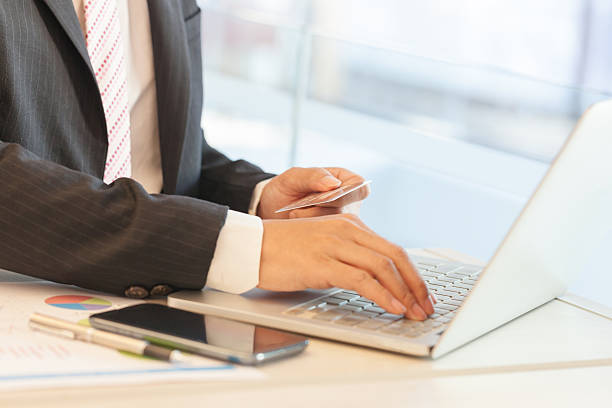 istock Businessman doing online banking. 635944866