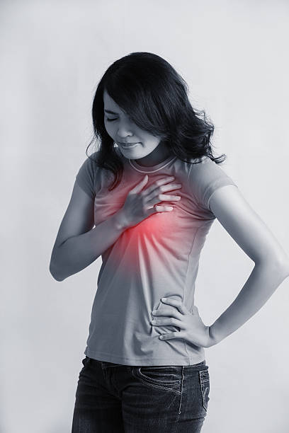 Woman with chest pain stock photo