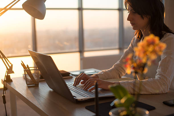 istock Female teleworker texting using laptop and internet, working online. Freelancer 635947982