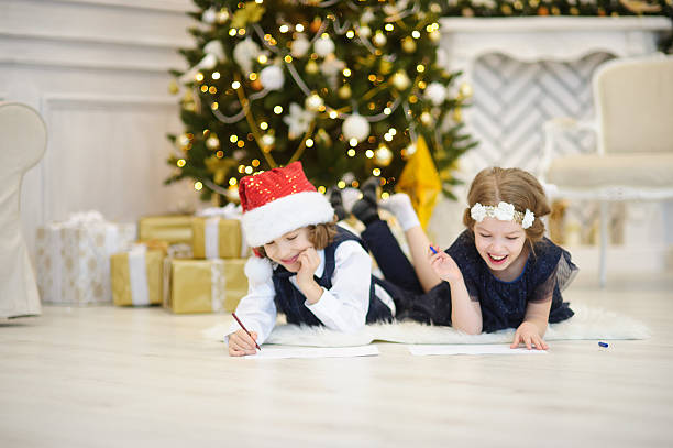 istock Children write letters to Santa Claus. 635949138