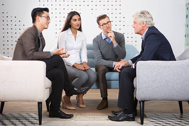 istock Young People Talking to Senior Business Leader 635949446