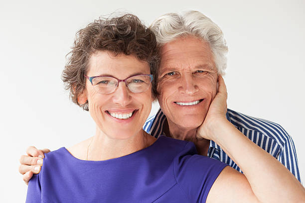 istock Happy Senior Couple Smiling and Embracing 635949680