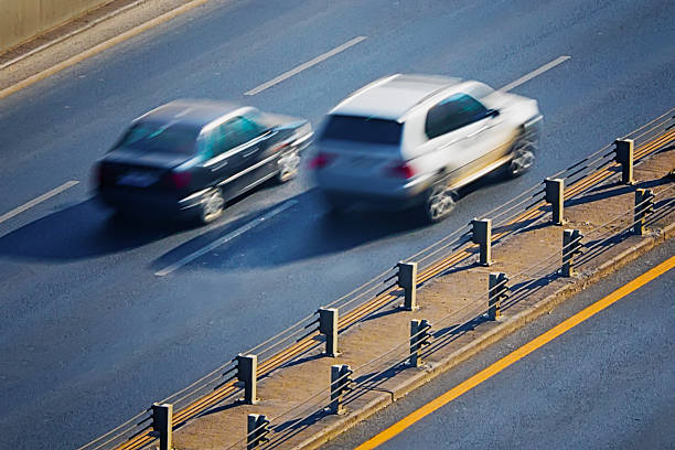 Two cars on highway - fotografia de stock