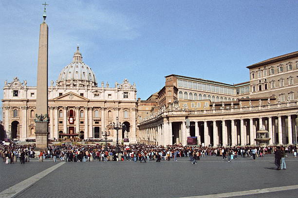 Vatican City, Vatican - April 16, 2006: People gather at the St Peter's square to attend the Easter celebration led by Pope Benedict XVI, in Vatican, Italy.