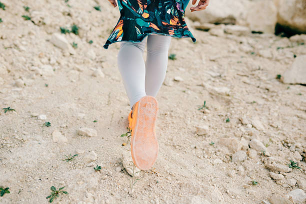 istock Young woman dressed colorful clothes posing and dancing 635950714