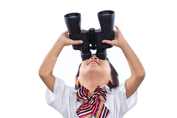 istock Asian Chinese little girl looking through binoculars 635950862
