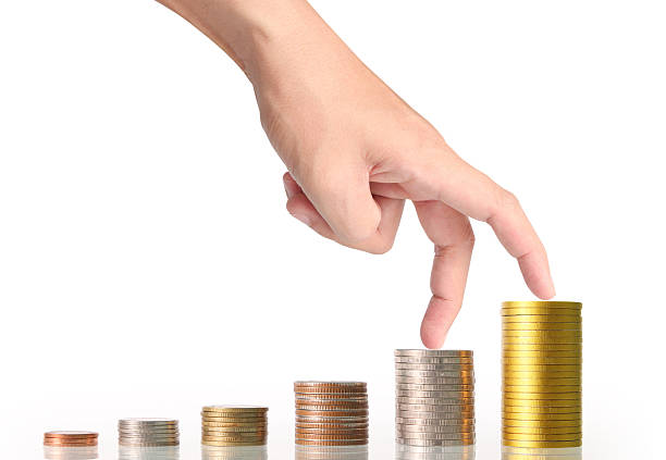 istock Hand human hand putting coin to money 635951236