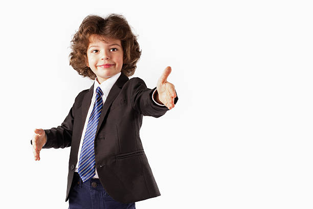 istock Curly happy boy stands, raised his hands. White background. 635958042
