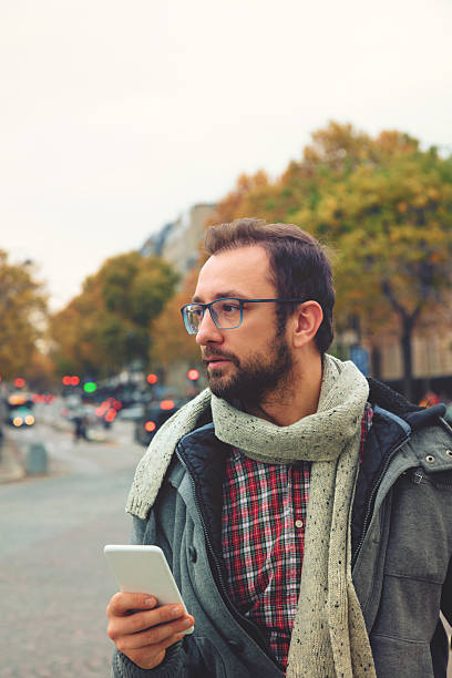 istock Modern guy using smartphone in the European city. 635958590