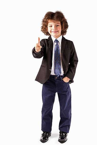 istock Cute little boy casually holds out his hand in greeting. 635959032