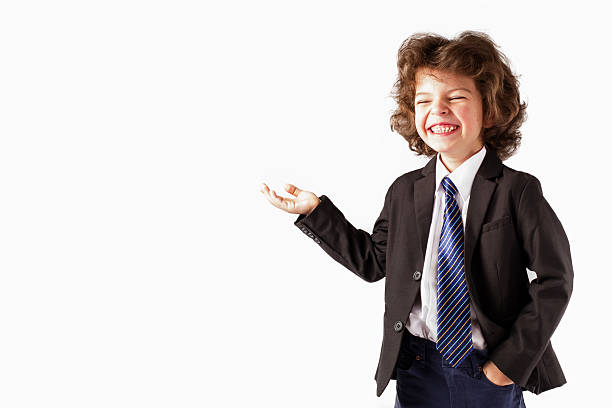 Cute little boy raised his right hand, palm up.