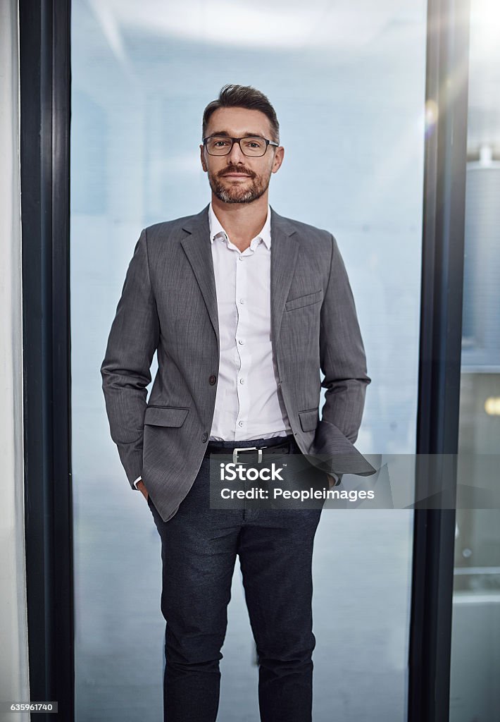 You succeed if you believe you will Portrait of a businessman standing in his office Adult Stock Photo
