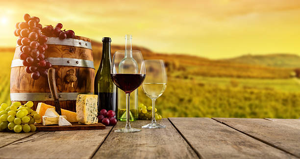 istock Red and white wine served on wooden planks 635964494