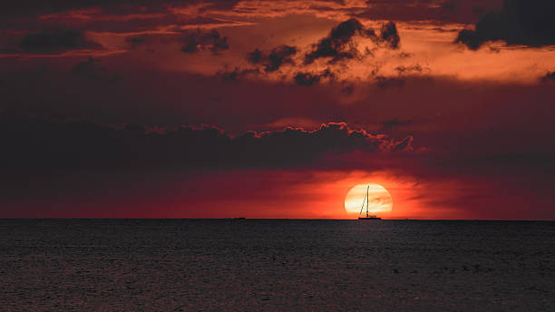 istock Yacht in front of the sunset 635964890