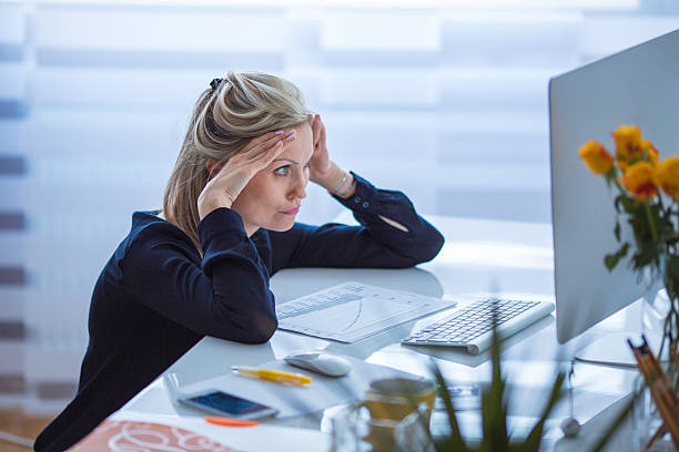 istock Business woman squatting next to the table 635965180