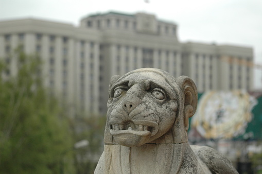 Moscow, Russia - May 12, 2006: Lion figure on monument of Victory over Napoleon at State Duma of Russian Federation background