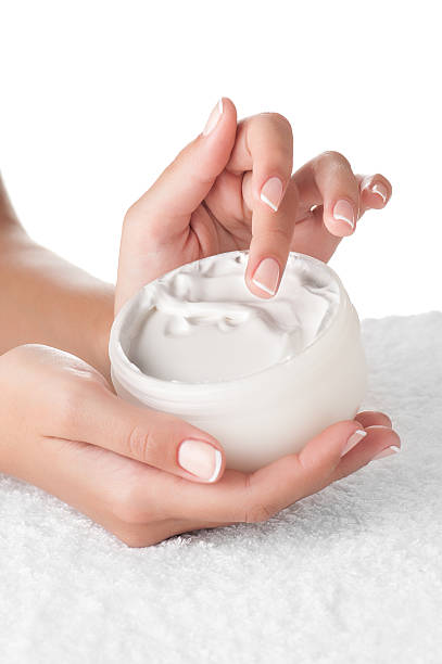 istock Woman applying cream 635965838