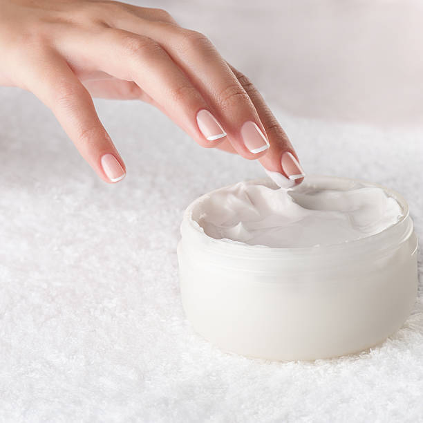 istock Woman applying cream 635965888