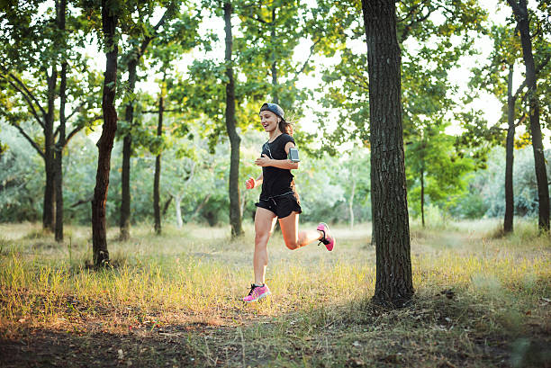 istock Female jogging in park 635966902