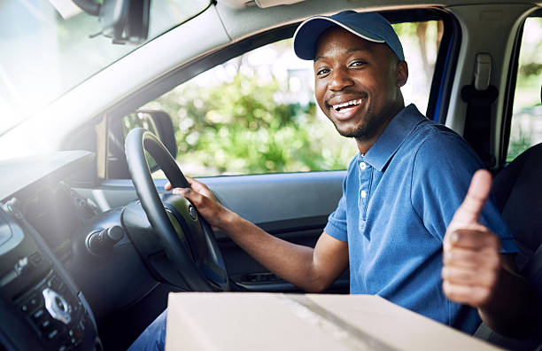 My deliveries always go out on time Portrait of a young postal working pulling thumbs up while sitting in his car during a delivery car portrait men expertise stock pictures, royalty-free photos & images