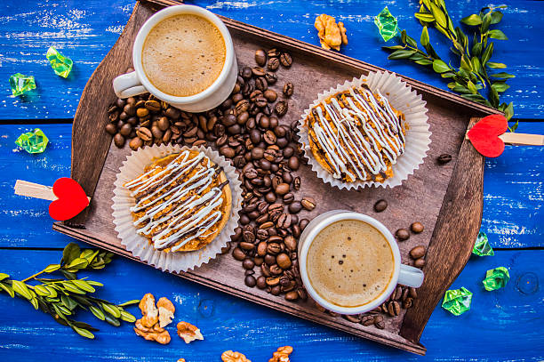 Cappuccino and cakes. On a blue background. Top view. Close