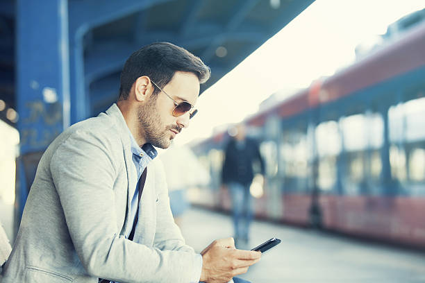istock Businessman on rail station 635969638