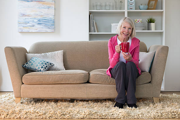 istock Senior lady sitting at home 635970060