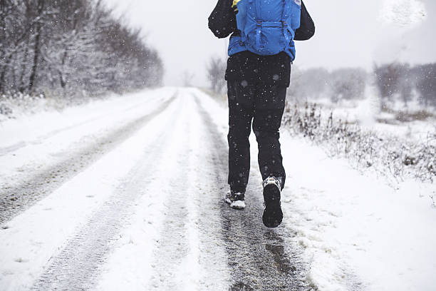 istock Man hiker hiking in white winter. 635970416
