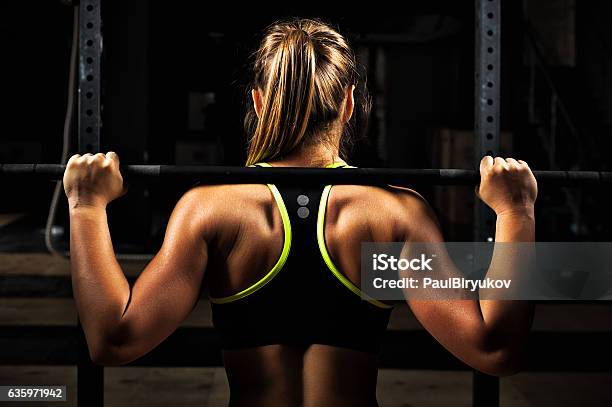 Back View Young Adult Girl Doing Barbell Squats Stock Photo - Download Image Now - Weightlifting, Weight Training, Women