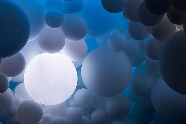 Close up of many blue balloons floating in a row