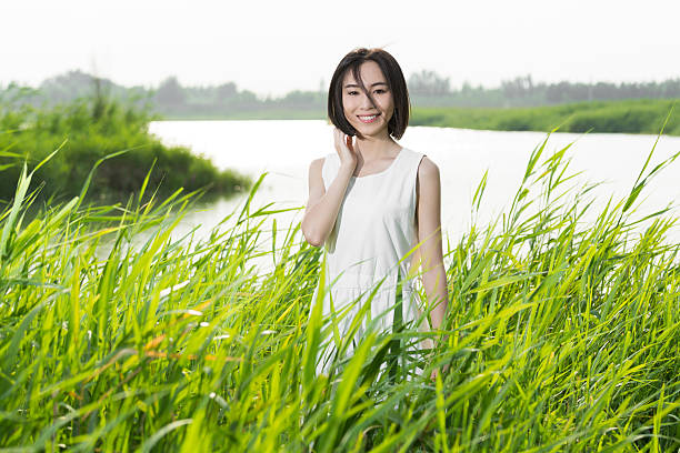 Glorious healthy brunette woman with long hairstyle and fresh skin walking outdoors