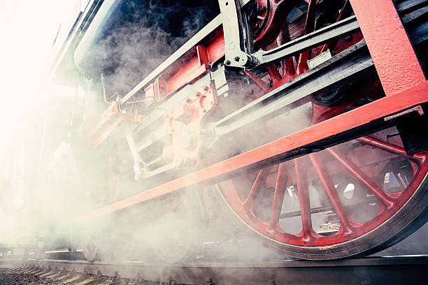 istock historical train close-up with steam 635978704