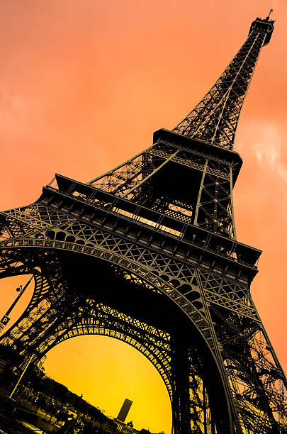 istock tour eiffel vertical monochrome coloured orange yellow sunset sunrise 635979348