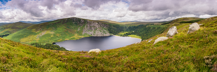 Lough Tay is a black lake with small white sand beach. It seems like a Guiness paint of beer so a lot of people knows the lake like Guiness Lake. Wiklow Mountains National Park, Republic of Ireland