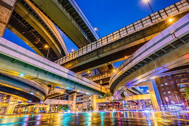 Osaka Japan Highway Junction Elevated Highways and Roads in Osaka, Japan. night freeway stock pictures, royalty-free photos & images