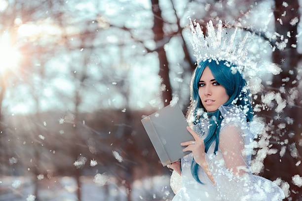 istock Snow Queen Reading Spell Book in Winter Fantasy 635981930