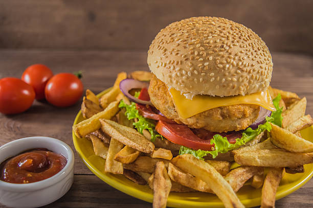 istock Big sandwich - hamburger burger with chicken, cheese, tomato. On 635983740